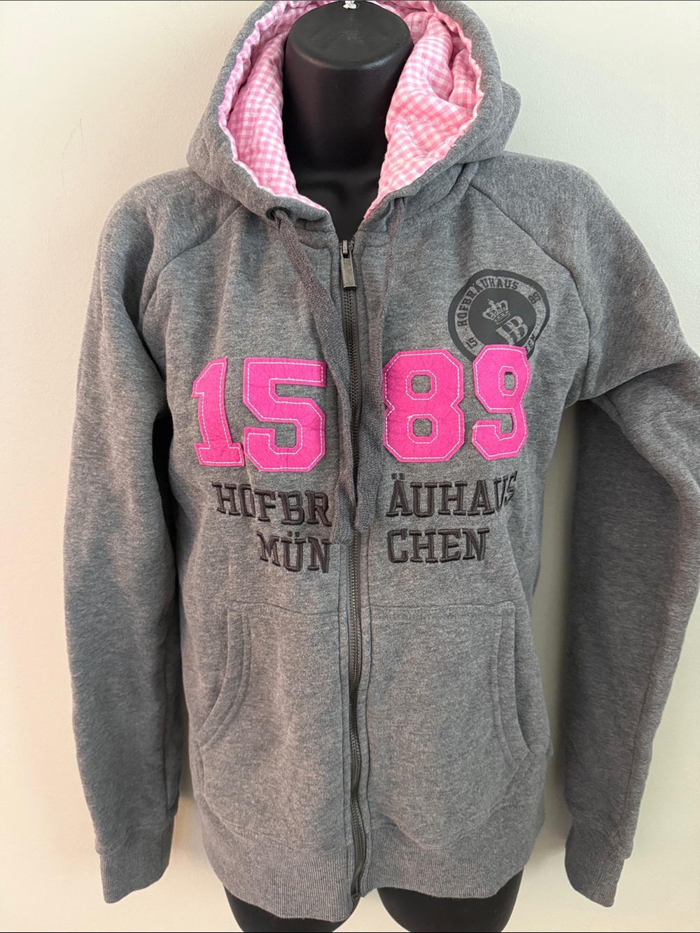 Hofbrauhaus Munchen Women’s Grey Zip Hoodie with Pink Lining “1589” Appliqué